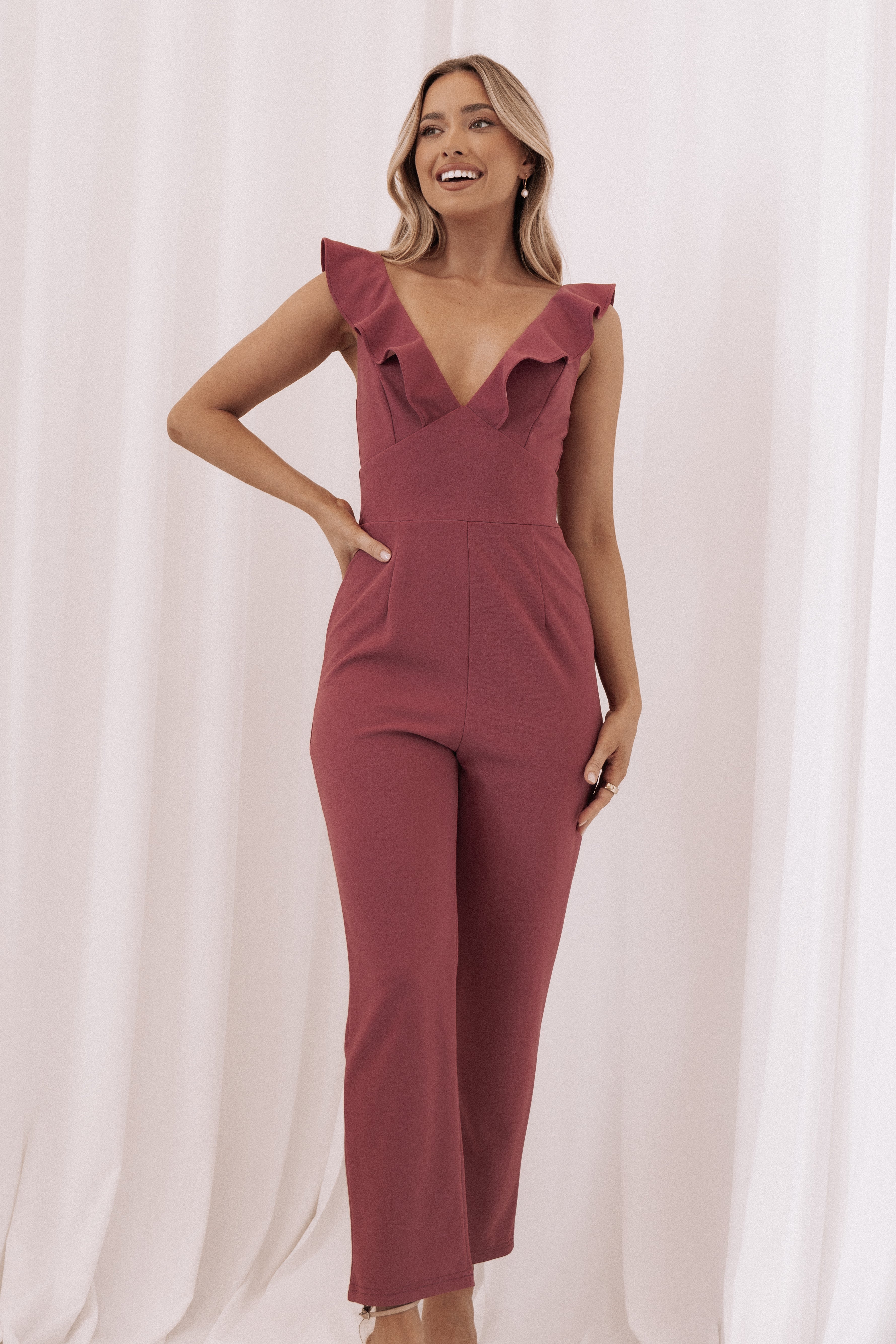 Mirabelle V-Neck Ruffle Jumpsuit in Dark Rose | Polyester-Spandex Blend